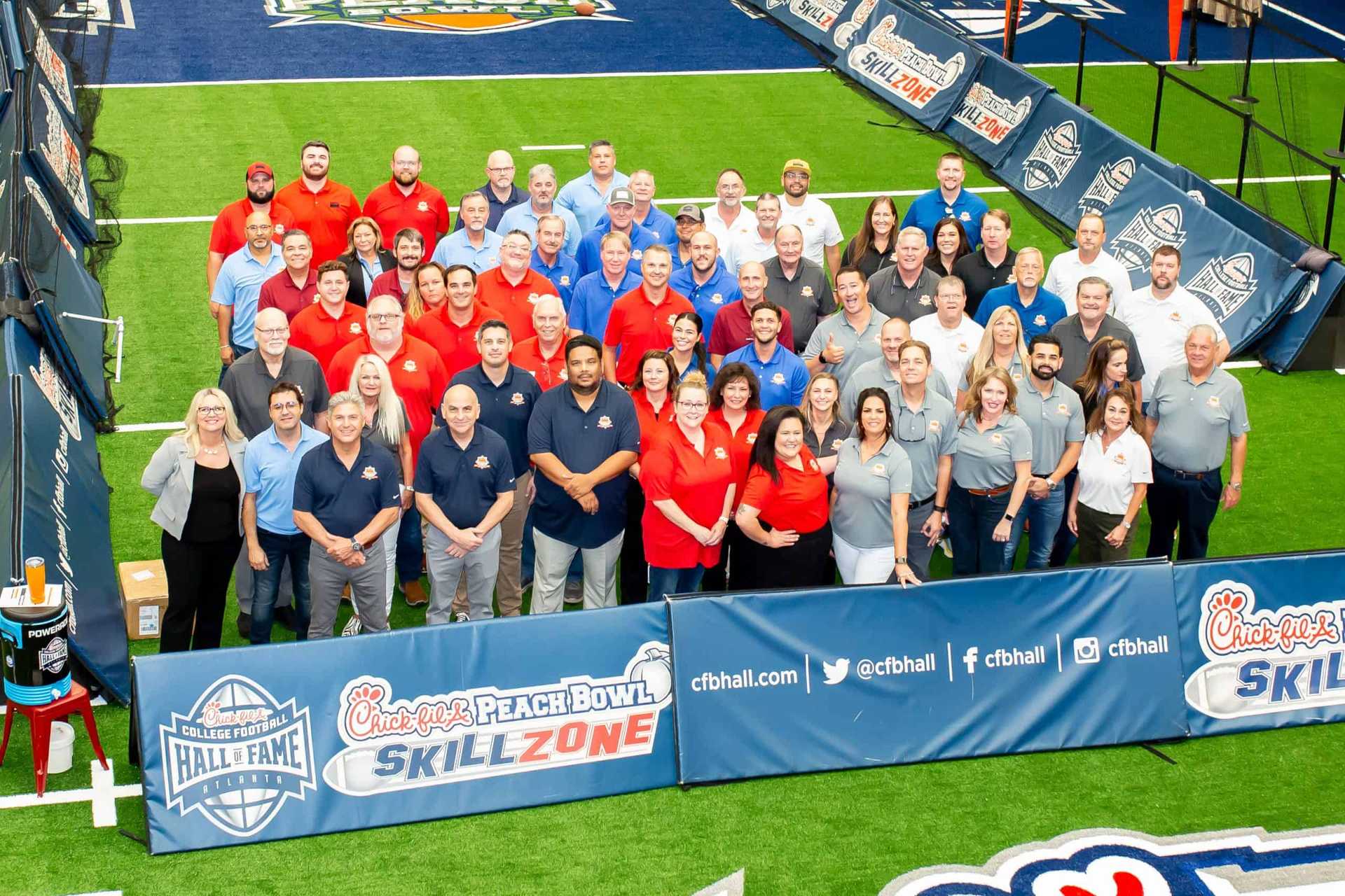 Group photo of Dixie Plywood and Lumber's College Football Hall of Fame event celebrating 80 years of business.